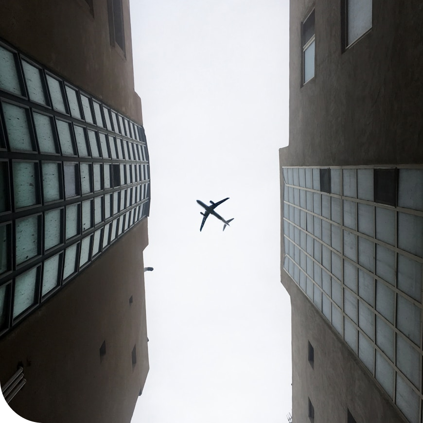 airplane between buildings